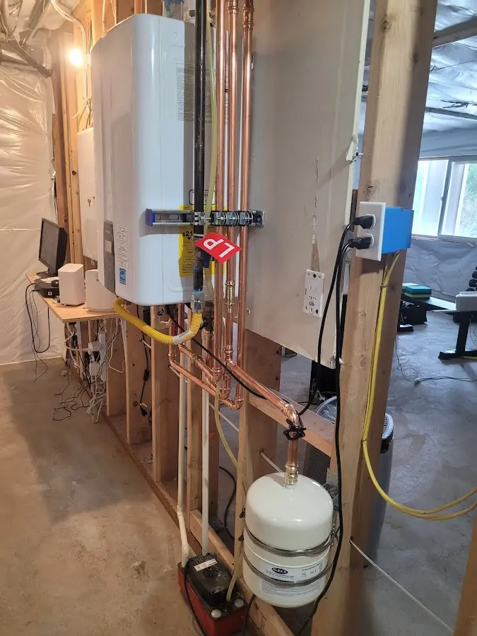 Licensed plumber repairing a kitchen sink in Merrill